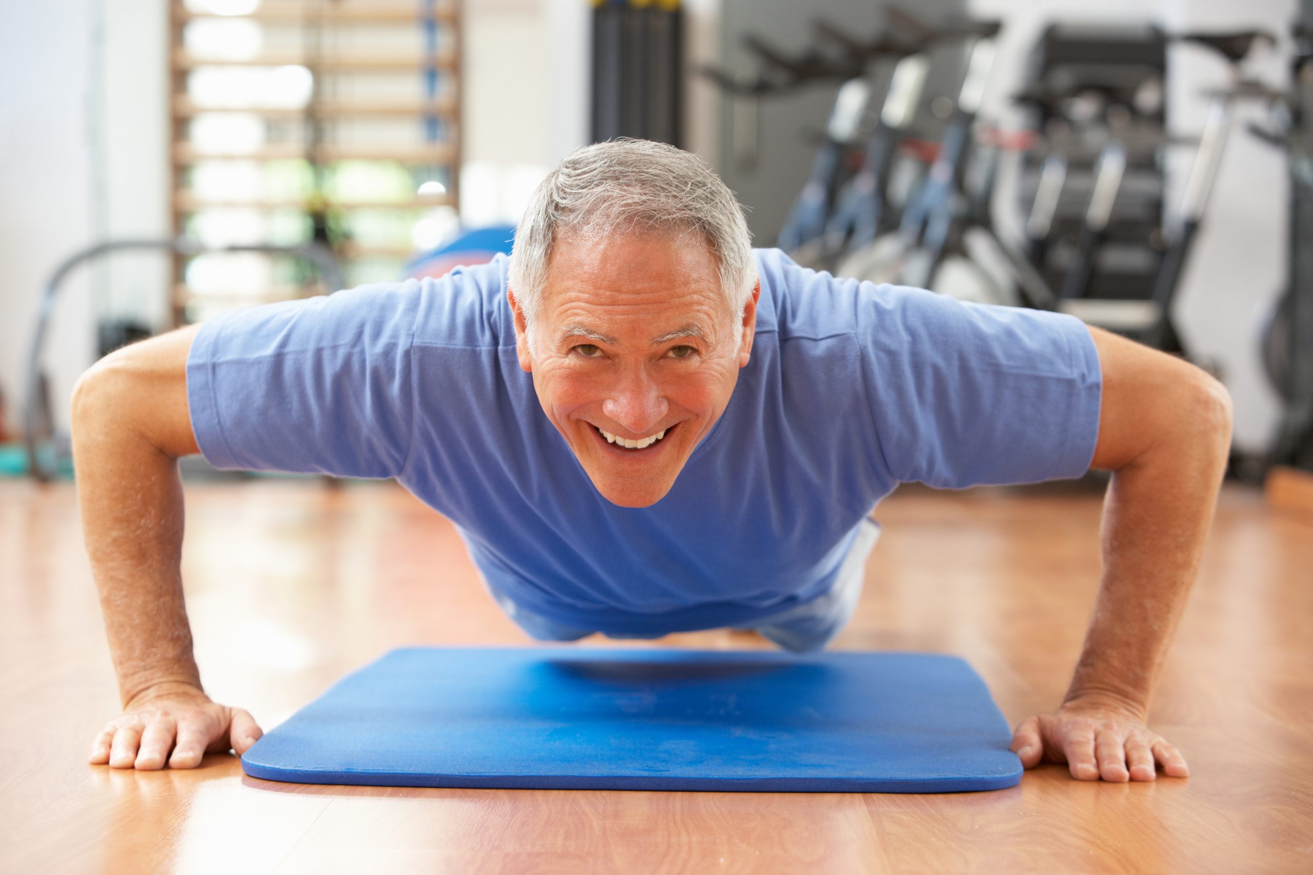 senior man doing pushups scaled